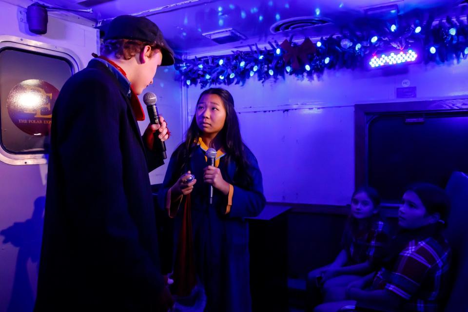 The hobo, left, and the Hero Child talk on Oklahoma City's "The Polar Express Train Ride," produced by Rail Events Productions, on Nov. 10, 2022, at the Oklahoma Railway Museum in Oklahoma City.