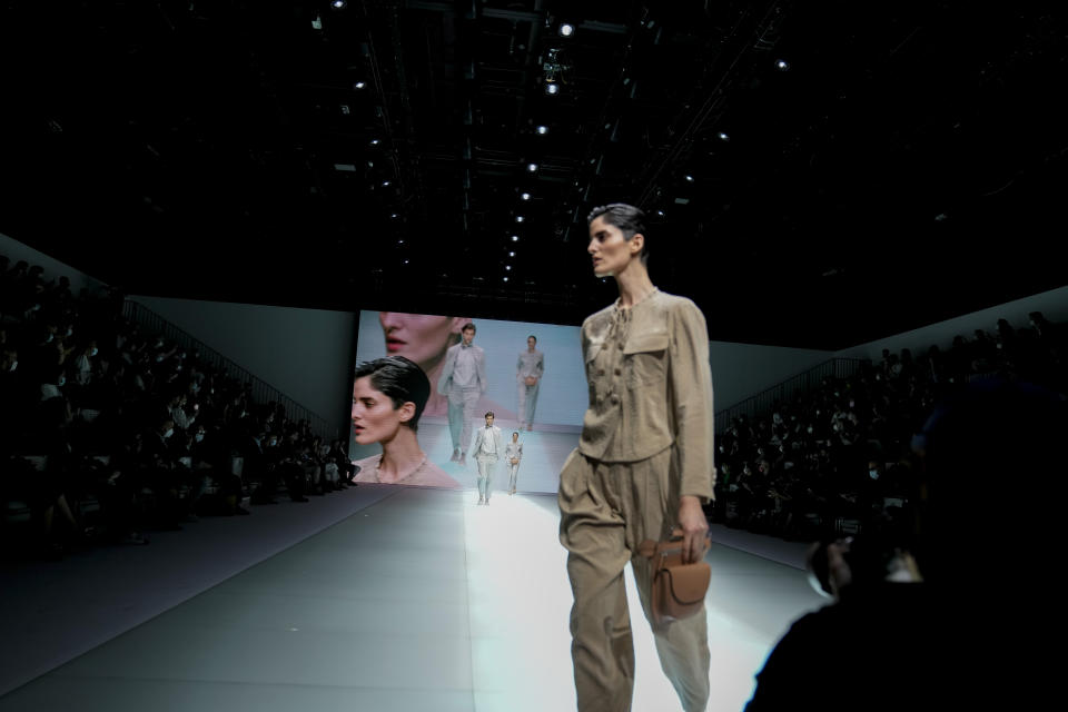 A model wears a creation for the Emporio Armani Spring Summer 2022 collection during Milan Fashion Week, in Milan, Italy, Thursday, Sept. 23, 2021. (AP Photo/Luca Bruno)