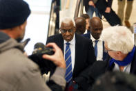 Former president of the IAAF (International Association of Athletics Federations) Lamine Diack, center, arrives at the Paris courthouse, Monday, Jan. 13, 2020. One of the biggest sports corruption cases to reach court is being heard in Paris from Monday, with explosive allegations of a massive doping cover-up at the top of track and field. (AP Photo/Thibault Camus)