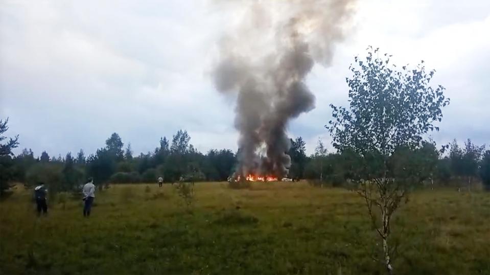 In this image taken from video, smoke and flames rise from a crashed private jet near the village of Kuzhenkino, Tver region, Russia, on Aug. 23, 2023.
