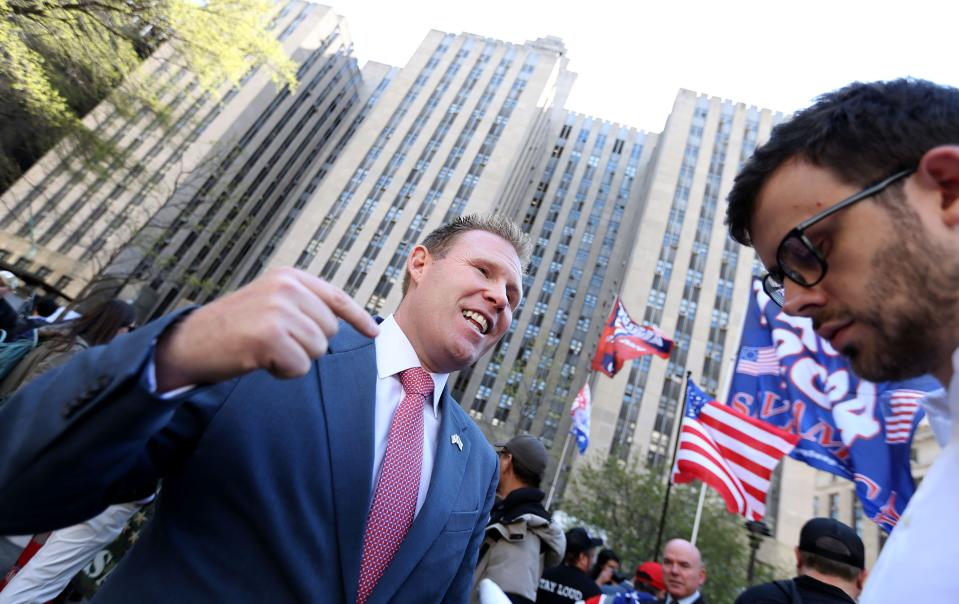 Andrew Giuliani, son of former NYC Mayor and Trump advisor Rudolph Giuliani, speaks with a reporter outside 100 Centre Street in New York Monday, April 15, 2024. Former President Donald Trump was inside NY Criminal Court Monday where a jury was being selected for his trial.