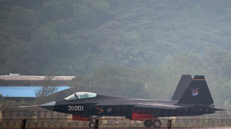 A J-31 stealth fighter taxis after a flight at the Airshow China 2014 in Zhuhai, south China's Guangdong province, on November 11, 2014