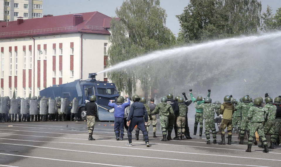 Belarusian Interior Ministry special forces take part in crowd dispersing training session during the Belarus President Alexander Lukashenko's visit at their base in Minsk, Belarus, Tuesday, July 28, 2020. The presidential election in Belarus is scheduled for Aug. 9, 2020. (Nikolai Petrov/BelTA Pool Photo via AP)