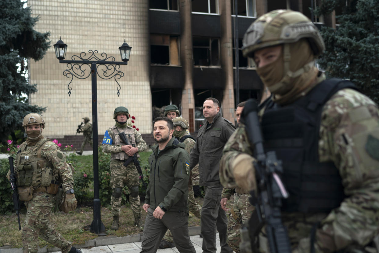 Ukrainian President Volodymyr Zelenskyy leaves after attending a national flag-raising ceremony in the freed Izium, Ukraine, Wednesday, Sept. 14, 2022. Zelenskyy visited the recently liberated city on Wednesday, greeting soldiers and thanking them for their efforts in retaking the area, as the Ukrainian flag was raised in front of the burned-out city hall building. (AP Photo/Leo Correa)