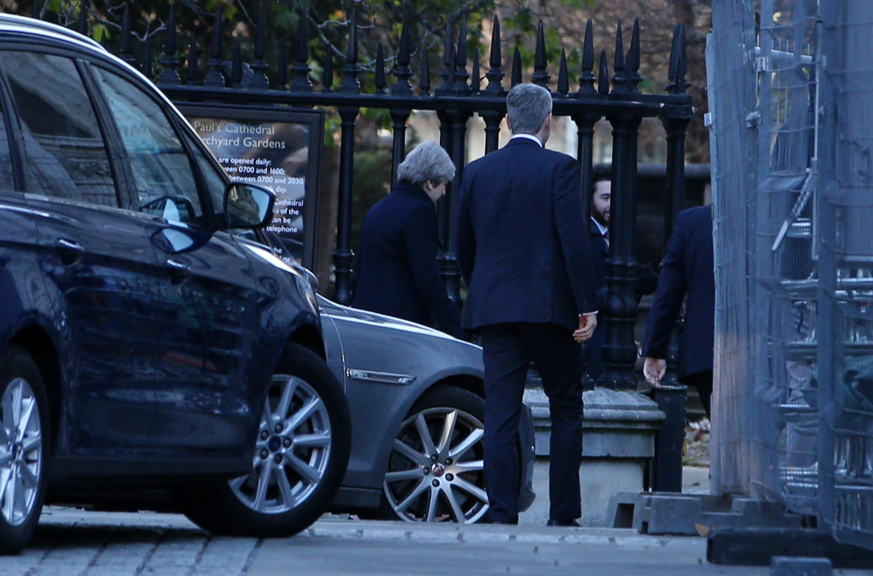 Theresa May enters at the back of St Pauls Cathedral (Picture: REX)