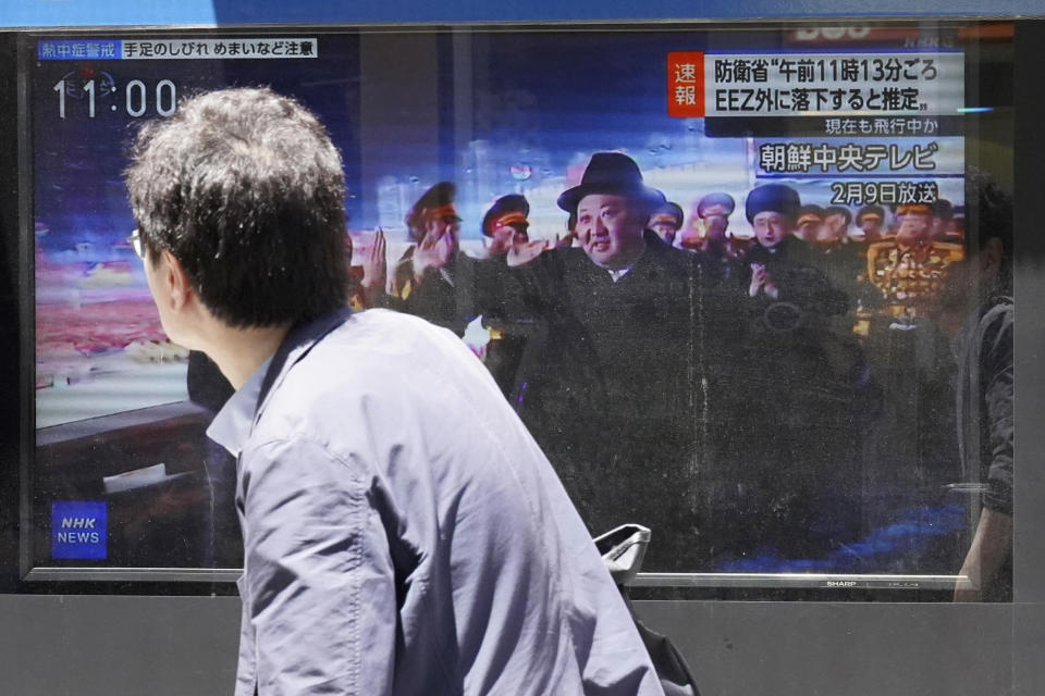 A person walks past a TV showing a news program on North Korea's missile launch Wednesday, July 12, 2023, in Tokyo. North Korea launched a long-range ballistic missile toward its eastern waters Wednesday, its neighbors said, two days after the North threatened “shocking” consequences to protest what it called a provocative U.S. reconnaissance activity near its territory. (AP Photo/Eugene Hoshiko)