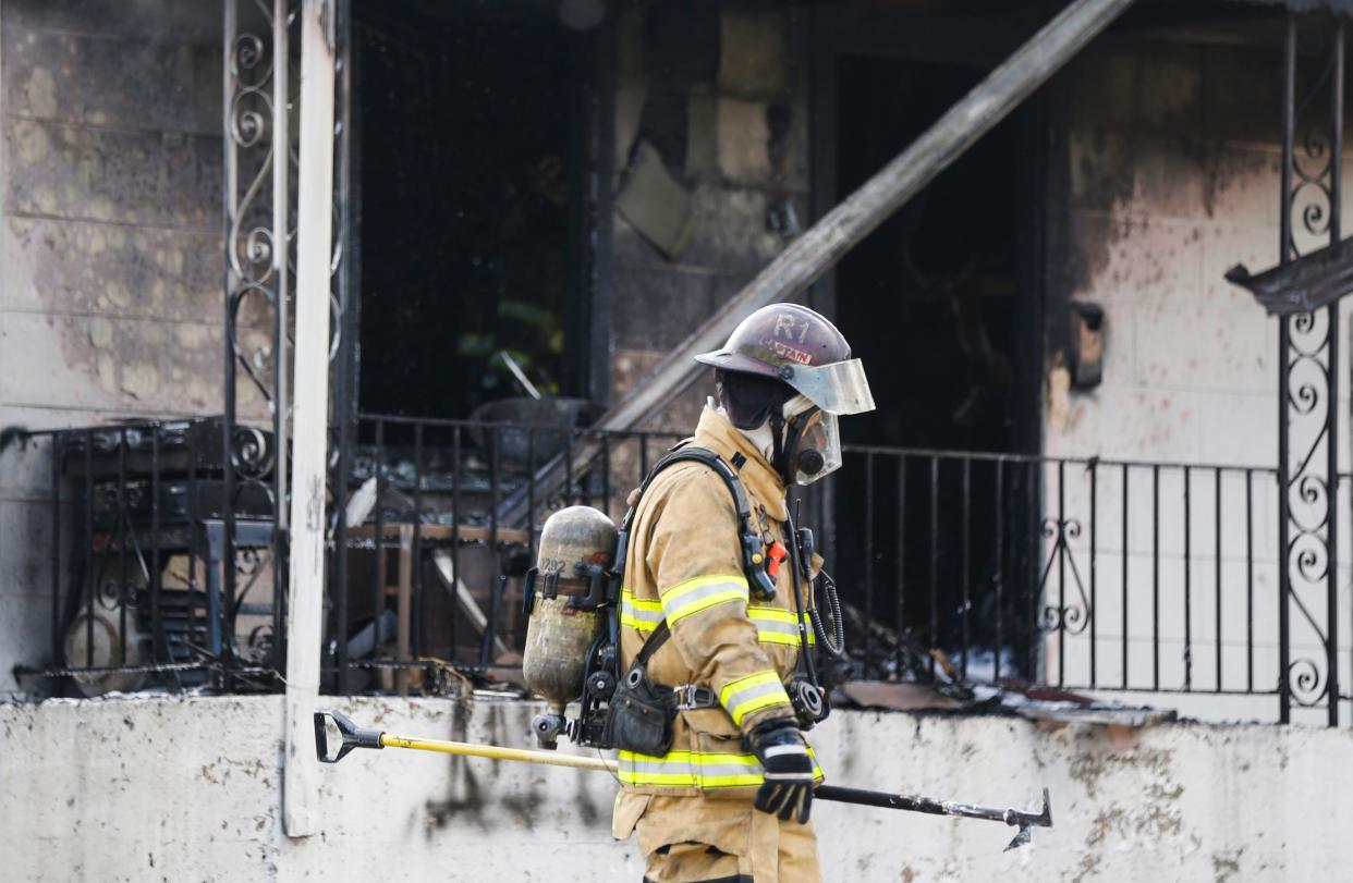 Springfield firefighters battle a building fire in the 1000 block of East Walnut Street on Tuesday, Nov. 29, 2022.