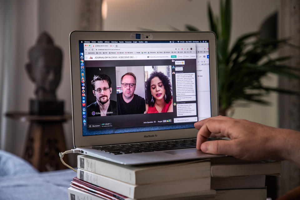 Christophe Deloire (R), Secretary General of Reporter Without Borders, attends a video conference call with Edward Snowden (L on the screen) and Rana Ayyub (R on the screen) during the launch of the 2020 Press Freedom Index in Paris in April 2020.<span class="copyright">Christophe Petit Tesson—EPA-EFE/Shutterstock</span>