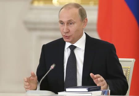 Russia's President Vladimir Putin speaks during a meeting of the State Council and the Presidential Council for Culture and Art, at the Kremlin in Moscow, December 24, 2014. REUTERS/Sergei Ilnitsky/Pool