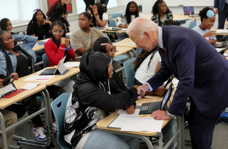 U.S. President Joe Biden and Jill Biden greet children on their first day of school, in Washington