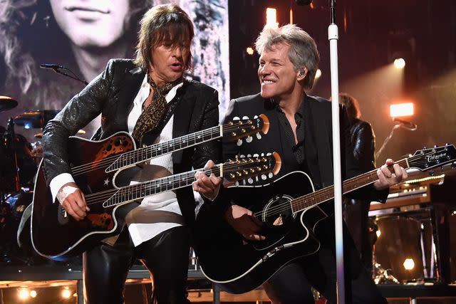 <p>Kevin Mazur/Getty</p> Richie Sambora and Jon Bon Jovi performing in Cleveland in April 2018