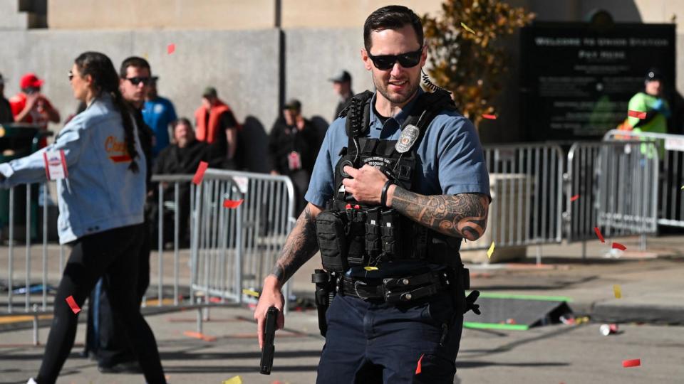 PHOTO: A Kansas City police office responds after shots were fired near the Kansas City Chiefs' Super Bowl LVIII victory parade, Feb. 14, 2024, in Kansas City, Missouri.  (Andrew Caballero-reynolds/AFP via Getty Images)