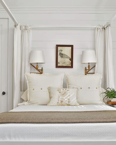 Laurey W. Glenn A discontinued white four-poster bed from Ikea makes the small room feel grander. With no room for table lamps, sconces (the <a href="http://www.circalighting.com/paulo-small-bracket-light-tob2203/" data-component="link" data-source="inlineLink" data-type="externalLink" data-ordinal="1">Paulo Small Bracket Light</a> from Circa Lighting) were the only choice. The bedposts also help hide their cords.