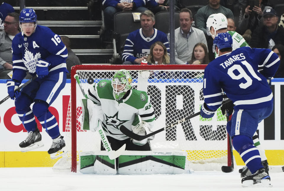 Dallas Stars goaltender Scott Wedgewood (41) is scored on as Toronto Maple Leafs forward Mitchell Marner (16) jumps out of the way of the shot during the first period of an NHL hockey game Wednesday, Feb. 7, 2024, in Toronto. (Nathan Denette/The Canadian Press via AP)