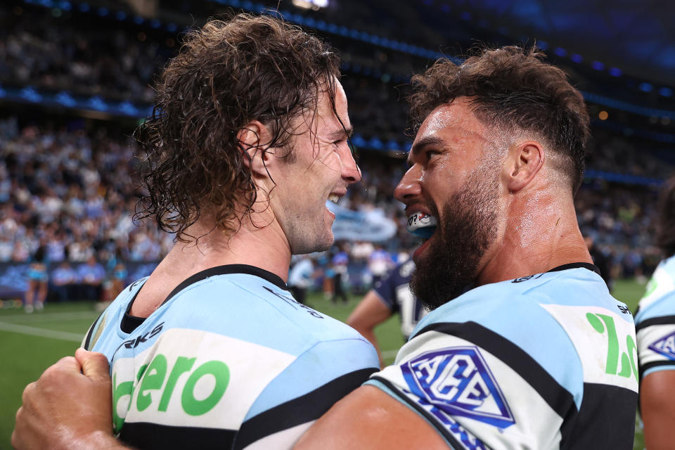 SYDNEY, AUSTRALIA - SEPTEMBER 20:  Nicho Hynes and Toby Rudolf of the Sharks celebrate winning the NRL Semi Final match between Cronulla Sharks and North Queensland Cowboys at Allianz Stadium on September 20, 2024 in Sydney, Australia. (Photo by Jason McCawley/Getty Images)