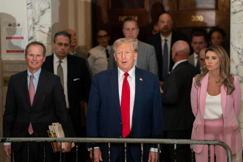 Flanked by his attorneys, former President Donald Trump speaks to the media while attending his trial in New York State Supreme Court on Dec. 7, 2023. / Credit: DAVID DEE DELGADO / Getty Images