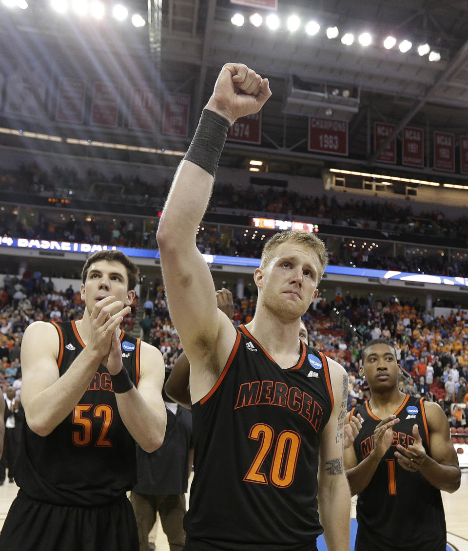 Mercer forward Jakob Gollon (20) waves to the crowd after the second half of an NCAA college basketball third-round tournament game against Tennessee, Sunday, March 23, 2014, in Raleigh. Tennessee Won 83-63. (AP Photo/Chuck Burton)