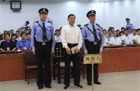 Ousted Chinese politician Bo Xilai (C) listens to his verdict inside the court in Jinan, Shandong province September 22, 2013, in this photo released by Jinan Intermediate People's Court. REUTERS/Jinan Intermediate People's Court/Handout via Reuters