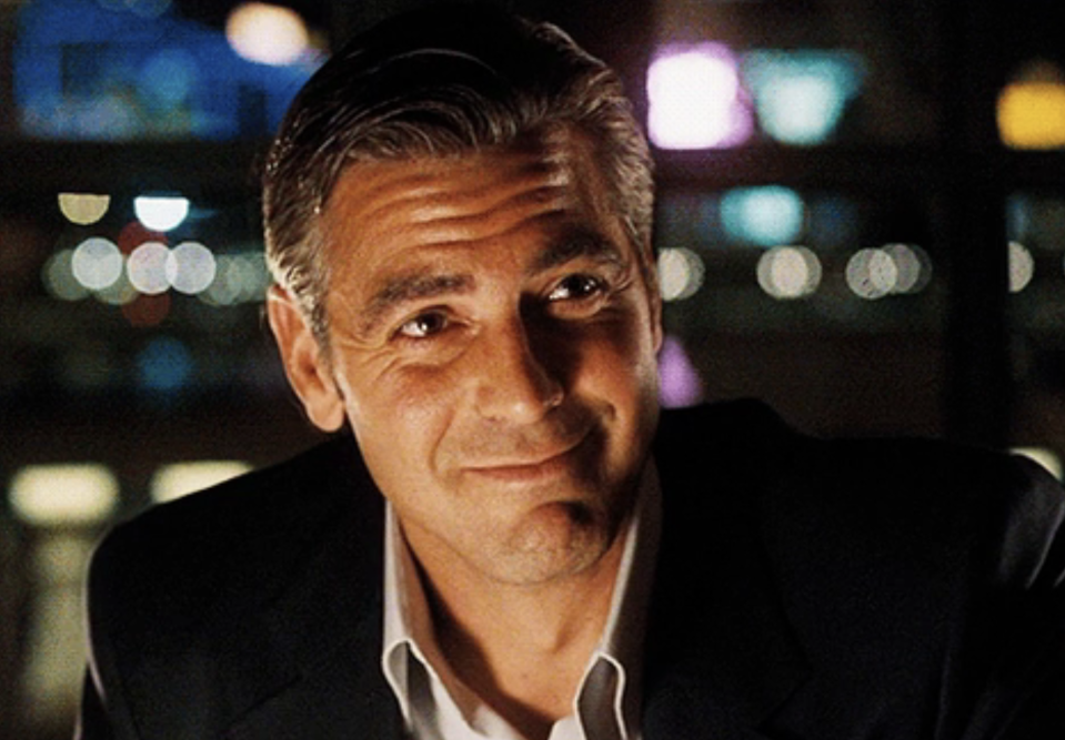 Close-up of George Clooney smirking in "Ocean's 11"
