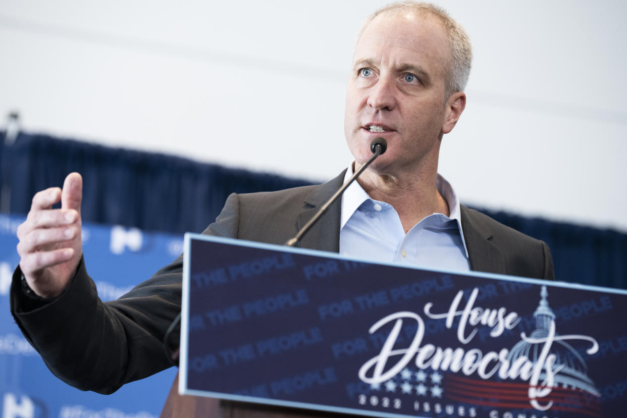 Rep. Sean Patrick Maloney speaks into a microphone at a podium with a sign reading House Democrats.