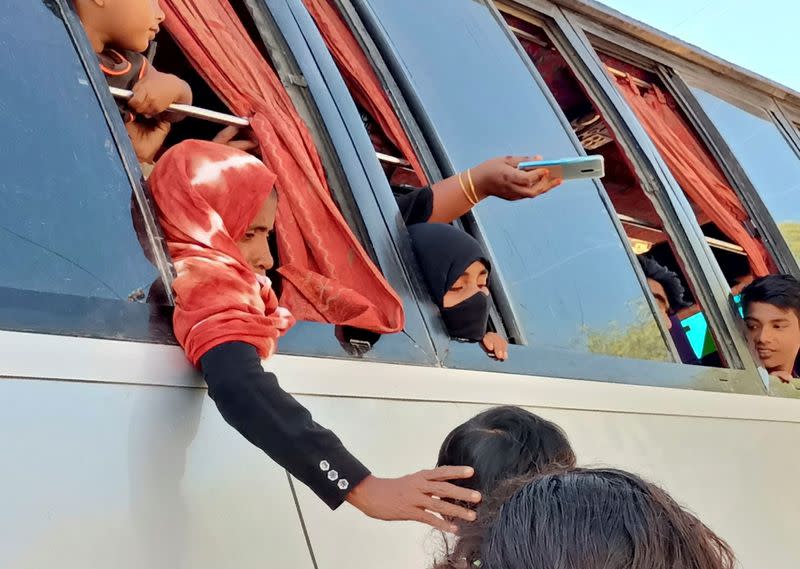 Rohingyas that will be shifted to Bhasan Char island are seen on board of a bus in Cox's Bazar