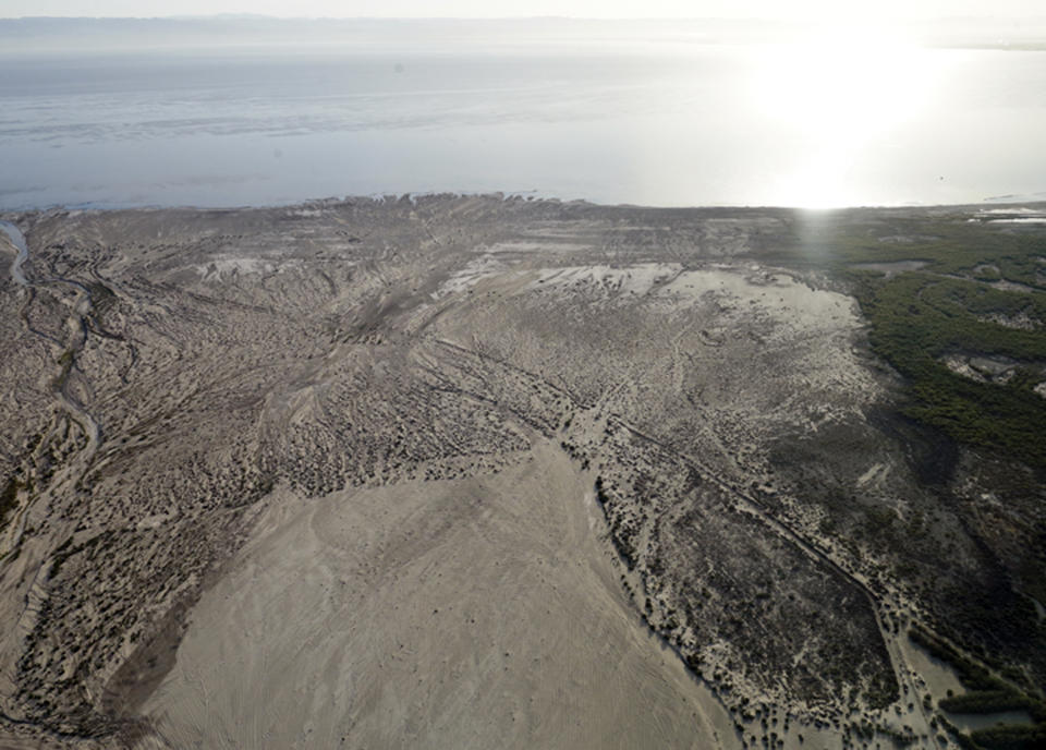FILE - This May 1, 2015 photo shows the exposed, fried lakebed of the Salton Seanear Niland, Calif. Work on a multistate plan to address drought on the Colorado River in the U.S. West won't be done to meet a Monday, March 4, 2019 federal deadline. A California irrigation district with the highest-priority rights to the river water says it won't approve the plan without securing money to restore the state's largest lake. The Imperial Irrigation District wants $200 million for the Salton Sea, a massive, briny lake in the desert southeast of Los Angeles. (AP Photo/Gregory Bull, File)