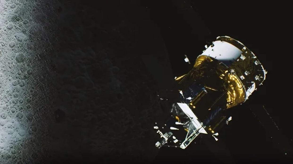  A gold-foil-covered cylindrical spacecraft above the moon. 