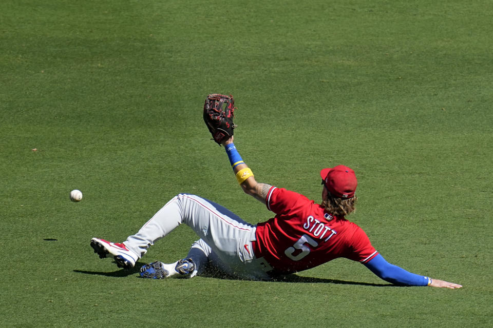 Philadelphia Phillies second baseman Bryson Stott can't reach a hit for a single by San Diego Padres' Manny Machado during the fourth inning of a baseball game Wednesday, Sept. 6, 2023, in San Diego. (AP Photo/Gregory Bull)