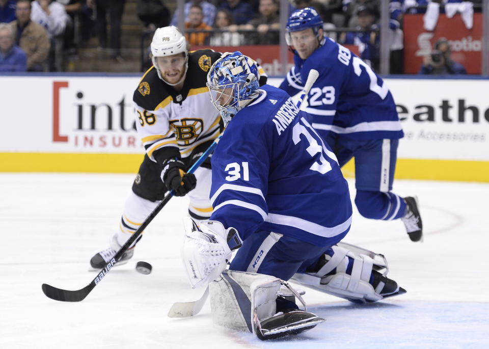 Toronto Maple Leafs goaltender Frederik Andersen (31) stops Boston Bruins right wing David Pastrnak (88) during the third period of Game 4 of an NHL hockey first-round playoff series Wednesday, April 17, 2019, in Toronto. (Nathan Denette/The Canadian Press via AP)