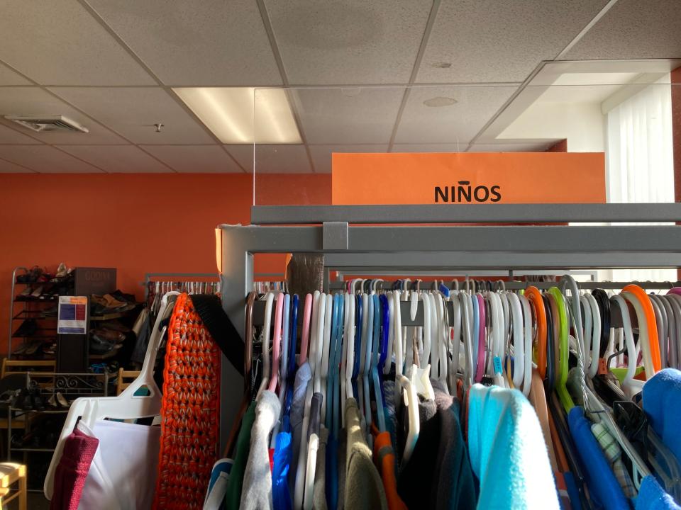 Ossining Padres Hispanos has rows of donated clothes for men, women and children. Nov. 18, 2021.