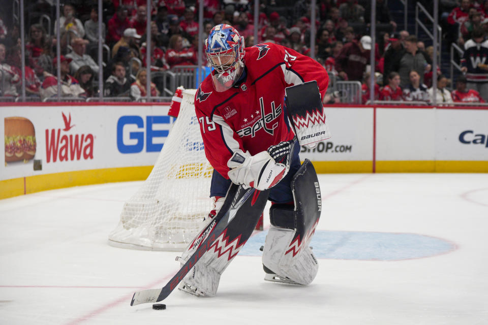 Washington Capitals goaltender Charlie Lindgren controls the puck during the second period of the team's NHL hockey game against the Columbus Blue Jackets, Saturday, Nov. 4, 2023, in Washington. (AP Photo/Jess Rapfogel)