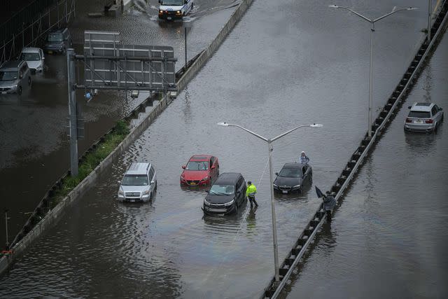 <p>ED JONES/AFP via Getty</p> Flooding in New York