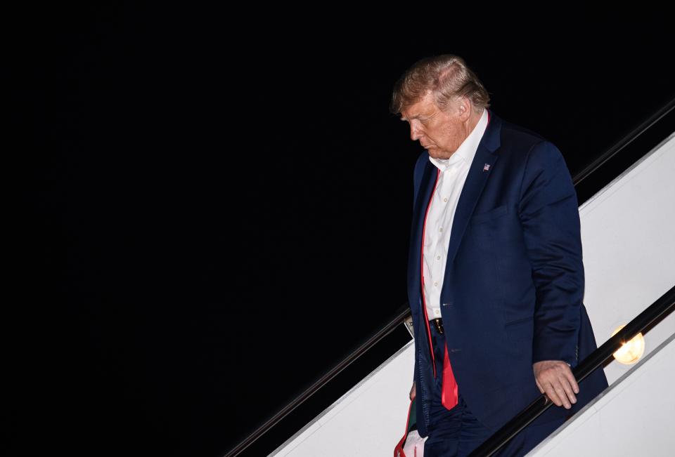 US President Donald Trump steps off Air Force One at Andrews Air Force Base in Maryland on June 21, 2020 after returning from a rally in Tulsa, Oklahoma. (Photo by NICHOLAS KAMM / AFP) (Photo by NICHOLAS KAMM/AFP via Getty Images)