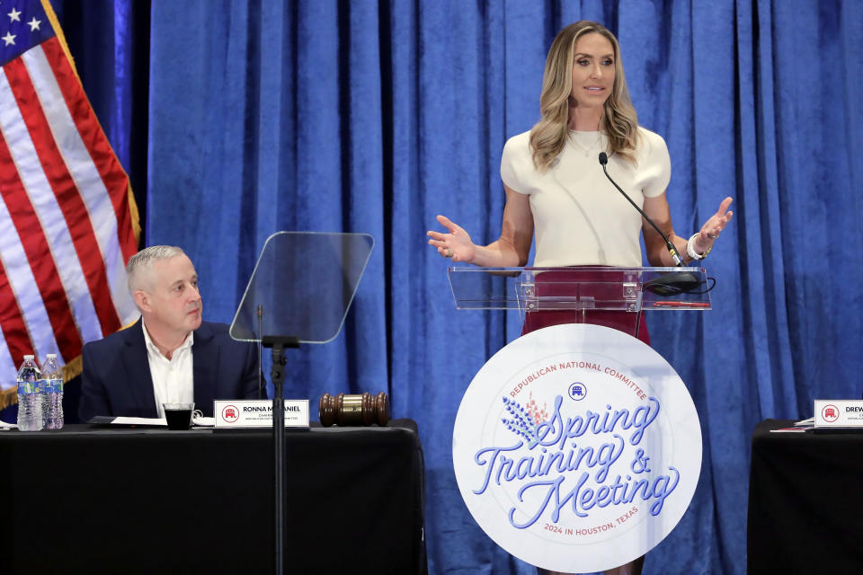 FILE - Lara Trump, the newly elected Republican National Committee Co-Chair, right, gives an address as newly elected Chairman Michael Whatley, left, listens during the general session of the RNC Spring Meeting Friday, March 8, 2024, in Houston. (AP Photo/Michael Wyke, File)