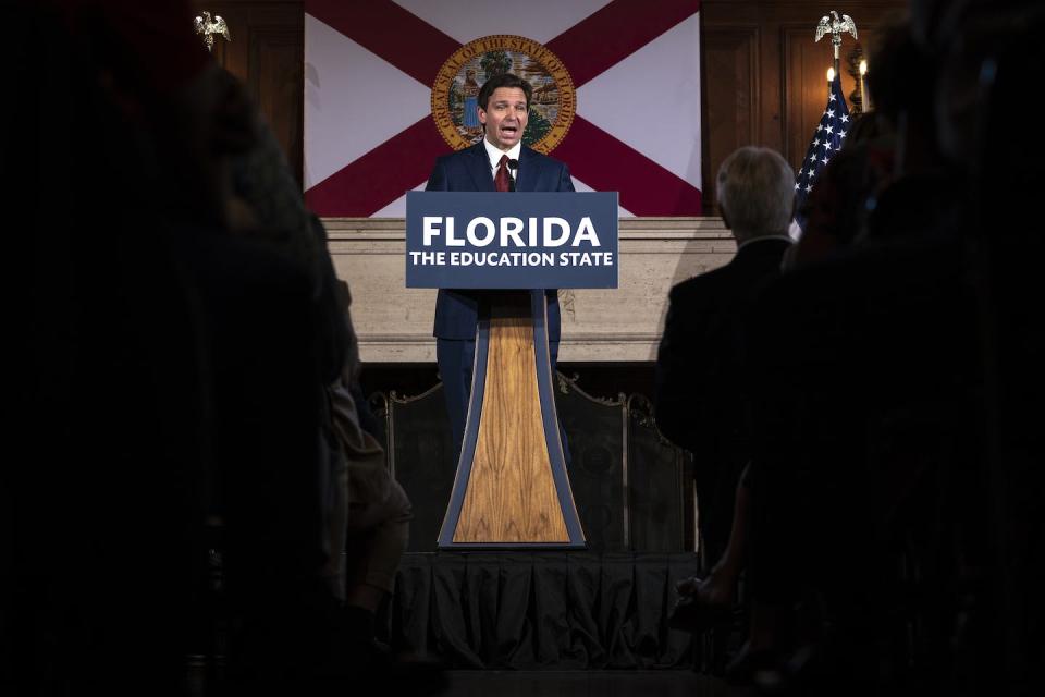 One bill signed in May 2023 by Florida Gov. Ron DeSantis, center, includes restrictions that bar public colleges in Florida from spending money on diversity, equity and inclusion programs. <a href="https://www.gettyimages.com/detail/news-photo/florida-governor-ron-desantis-takes-questions-from-the-news-photo/1255657321?adppopup=true" rel="nofollow noopener" target="_blank" data-ylk="slk:Thomas Simonetti for The Washington Post via Getty Images;elm:context_link;itc:0;sec:content-canvas" class="link ">Thomas Simonetti for The Washington Post via Getty Images</a>