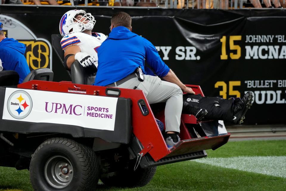 Buffalo Bills offensive tackle Tommy Doyle is taken off the field after an injury in the second half of an NFL preseason football game against the Pittsburgh Steelers, in Pittsburgh, Saturday, Aug. 19, 2023.