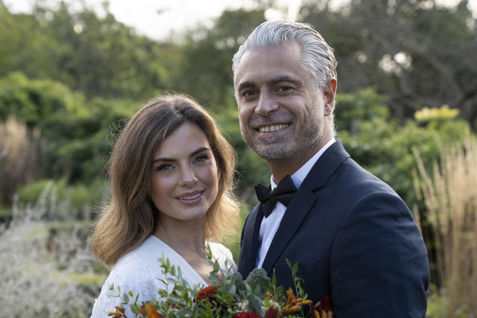 A smiling bride and groom