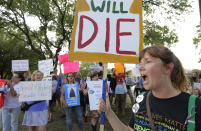 <p>Protesters gather outside a Sen. Ted Cruz town hall meeting, Thursday, July 6, 2017, in Austin, Texas. Cruz is expressing doubt about whether the Republican plan to repeal and replace former President Barack Obama’s health care law will pass the Senate, suggesting Thursday that efforts to cobble together enough votes are on shaky ground. Protesters were defending the Obama administration’s health law and waving anti-Cruz signs. (Photo: Eric Gay/AP) </p>