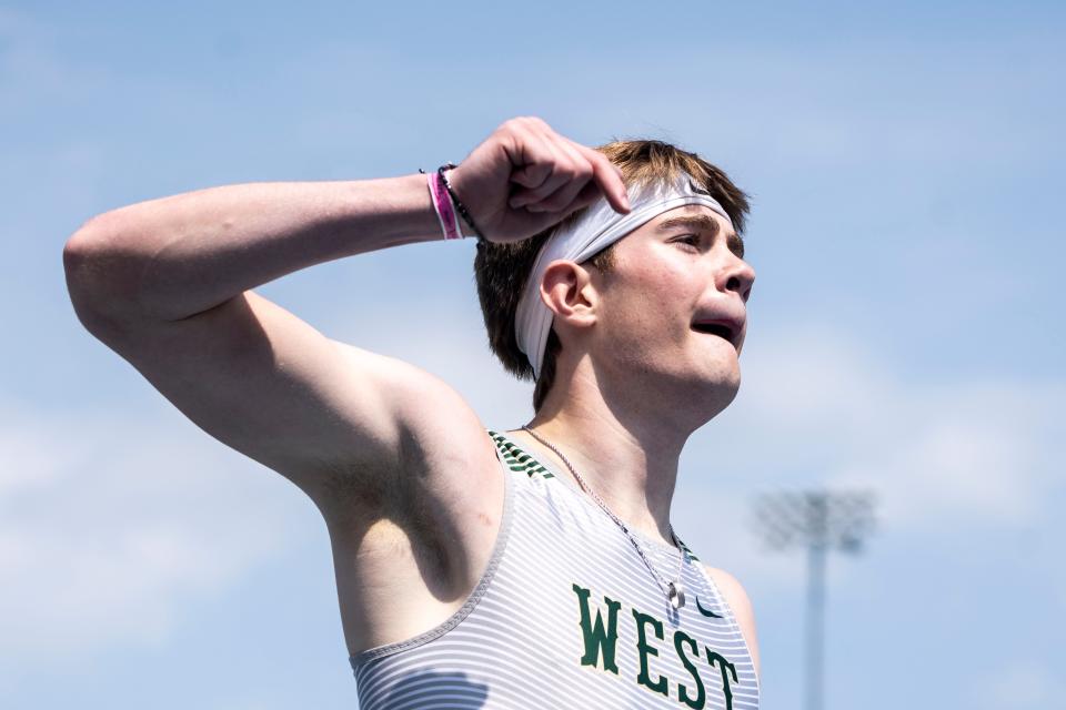 Iowa City West's Aidan Jacobsen celebrates after winning the 400-meter hurdles during the Drake Relays at Drake Stadium on Saturday, April 27, 2024, in Des Moines. He finished with a time of 52.03.