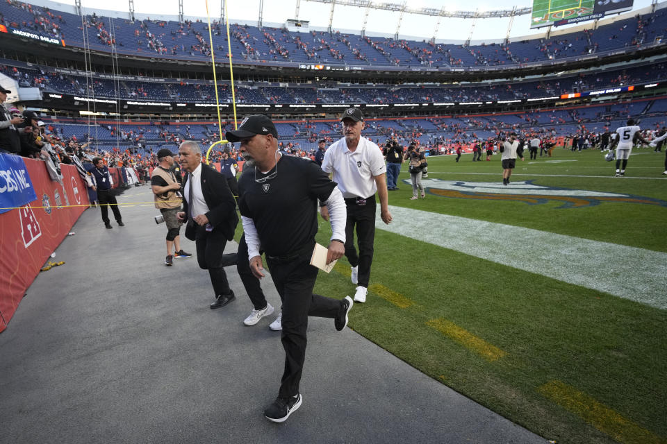 Las Vegas Raiders interim head coach Rich Bisaccia leaves the field after an NFL football game against the Denver Broncos, Sunday, Oct. 17, 2021, in Denver. The Raiders won 34-24. (AP Photo/David Zalubowski)