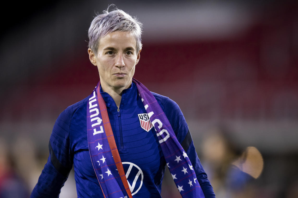 WASHINGTON, DC - SEPTEMBER 06: Megan Rapinoe #15 of United States wears an Equal Pay scarf and walks off the pitch after winning the friendly match against Nigeria and the watching the signing of the historic collective bargaining agreement signifying equal pay between the men's and women's national soccer teams at Audi Field on September 06, 2022 in Washington, DC (Photo by Ira L. Black - Corbis/Getty Images)