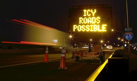 A travel warning sign is seen along Interstate 65 as cold weather descends on Mobile, Alabama January 28, 2014. REUTERS/Lyle Ratliff (UNITED STATES - Tags: ENVIRONMENT)