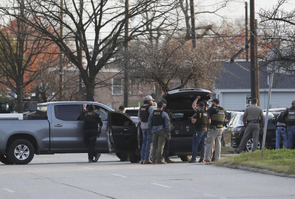 Houston Police officers work at a scene Thursday, Jan. 27, 2022, near the intersection of Lockwood Drive and Hershe Street in Houston. Authorities say a police chase in Houston ended with a shootout that wounded three officers. The incident happened about 2:40 p.m. Thursday when a car that police were pursuing crashed at an intersection just off Interstate 69 on the southeastern edge of downtown Houston. (Jon Shapley/Houston Chronicle via AP)