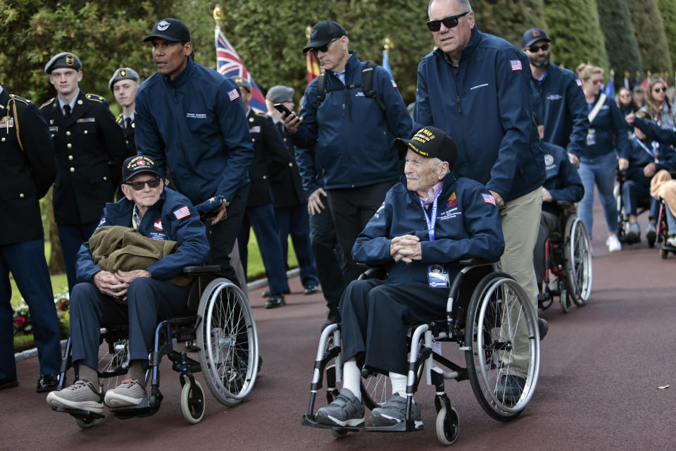 U.S. veterans and family members attend the 78th anniversary of D-Day ceremony, in the Normandy American Cemetery and Memorial of Colleville-sur-Mer, Monday, June, 6, 2022. The ceremonies pay tribute to the nearly 160,000 troops from Britain, the U.S., Canada and elsewhere who landed on French beaches on June 6, 1944, to restore freedom to Europe after Nazi occupation. (AP Photo/ Jeremias Gonzalez)