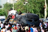 The float of the MMFF 2012 entry "Shake Rattle and Roll 14: The Invasion" makes its way through the crowd at the 2012 Metro Manila Film Festival Parade of Stars on 23 December 2012. (Angela Galia/NPPA Images)
