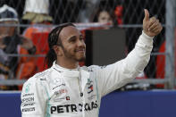 Mercedes driver Lewis Hamilton of Britain celebrates after setting the second fastest time at the end of the qualifying session practice at the 'Sochi Autodrom' Formula One circuit, in Sochi, Russia, Saturday, Sept. 28, 2019. The Formula one race will be held on Sunday. (AP Photo/Luca Bruno)