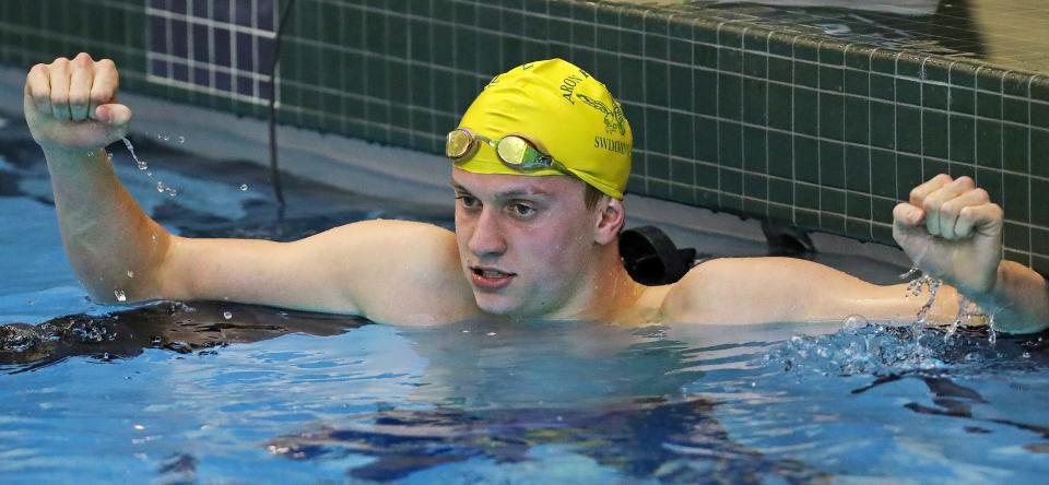 Firestone senior Jonny Marshall celebrates after setting the pool record in the boys 200 freestyle with a time of 1:37.89 during his final home meet Jan. 24, 2023.