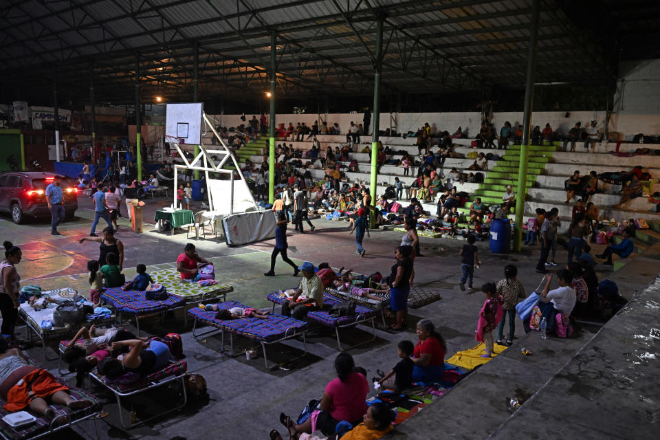 People gather at a shelter in a sports center after fleeing from their village affected by Fuego volcano in Santa Lucia Cotzumalguapa, Escuintla south of Guatemala City, on May 4, 2023.