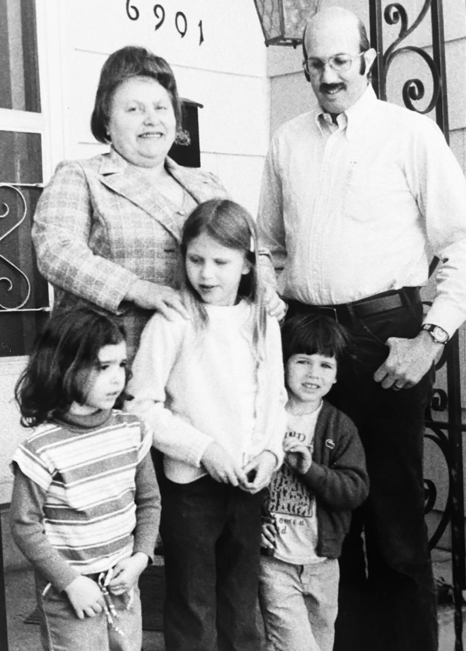 Family friend Bronia Roslawowski with me (her hands on my shoulders), my father, my brother and one of her grandchildren. 
 (Courtesy Sarah Gundle)
