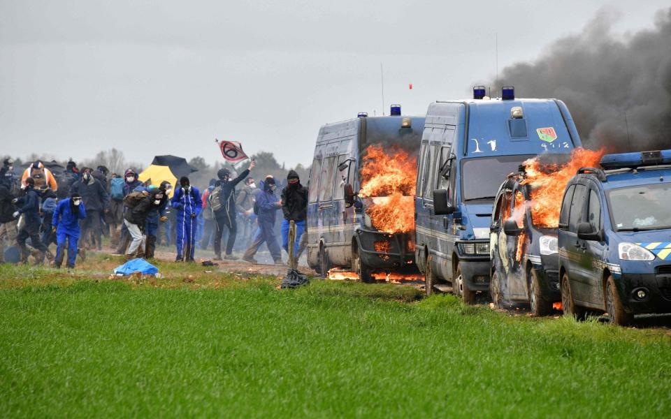 French gendarmerie vehicles are burning during clashes - AFP